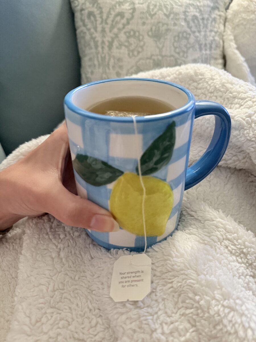 tea in a gingham mug with a lemon