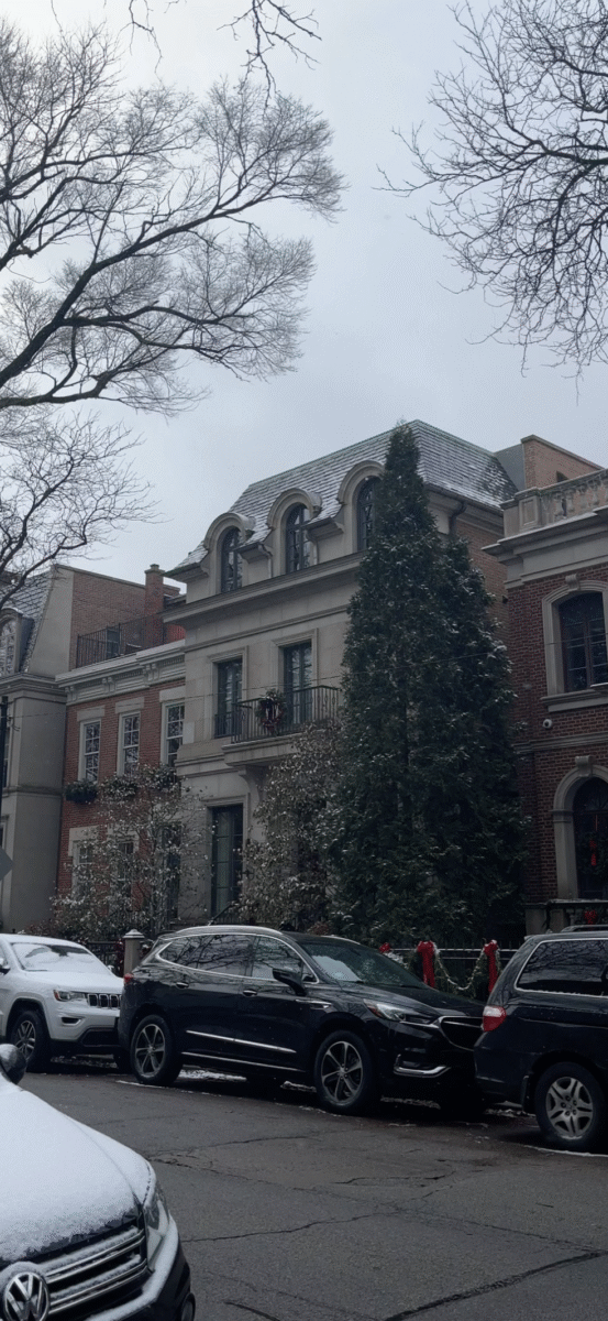 a city street in winter, with snow on cars
