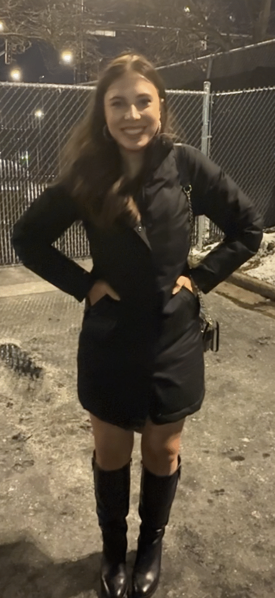 a woman in a parka and tall boots